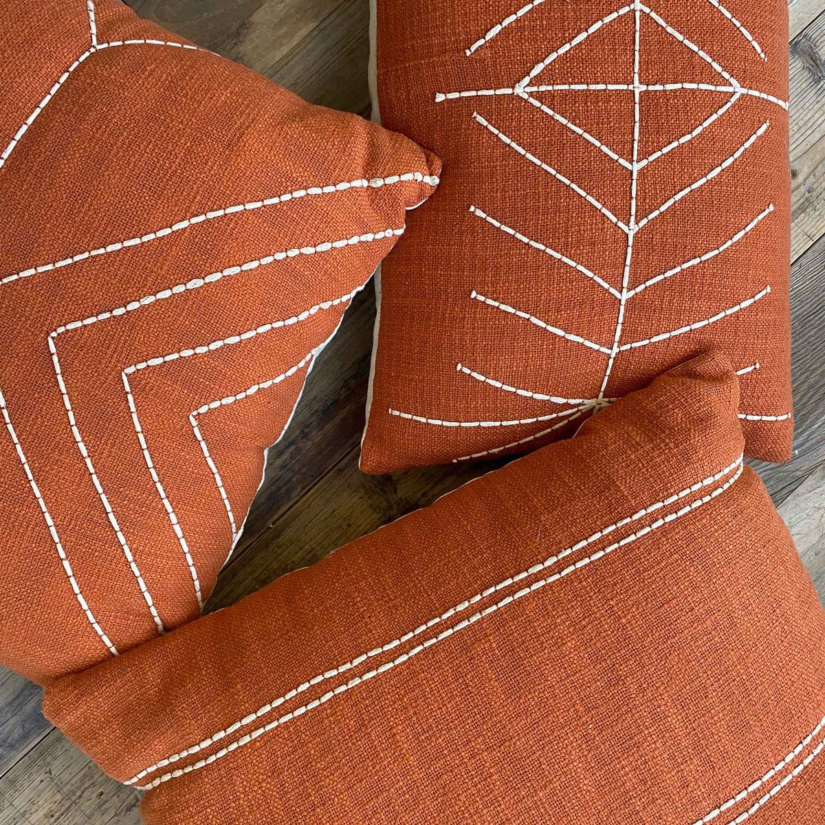 Selection of orange and white stripe pattern HIRA cushions from Shack
